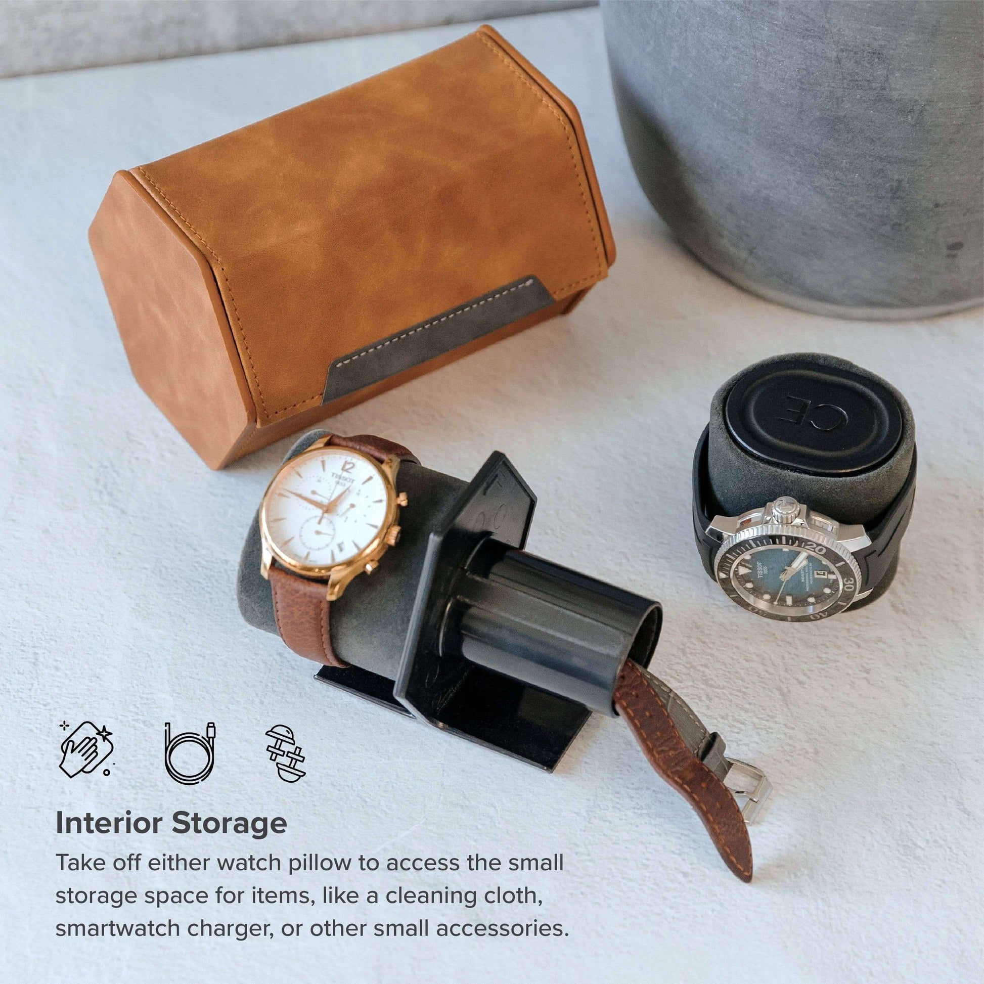 2-slot travel watch roll displayed with two watches and storage space for accessories.