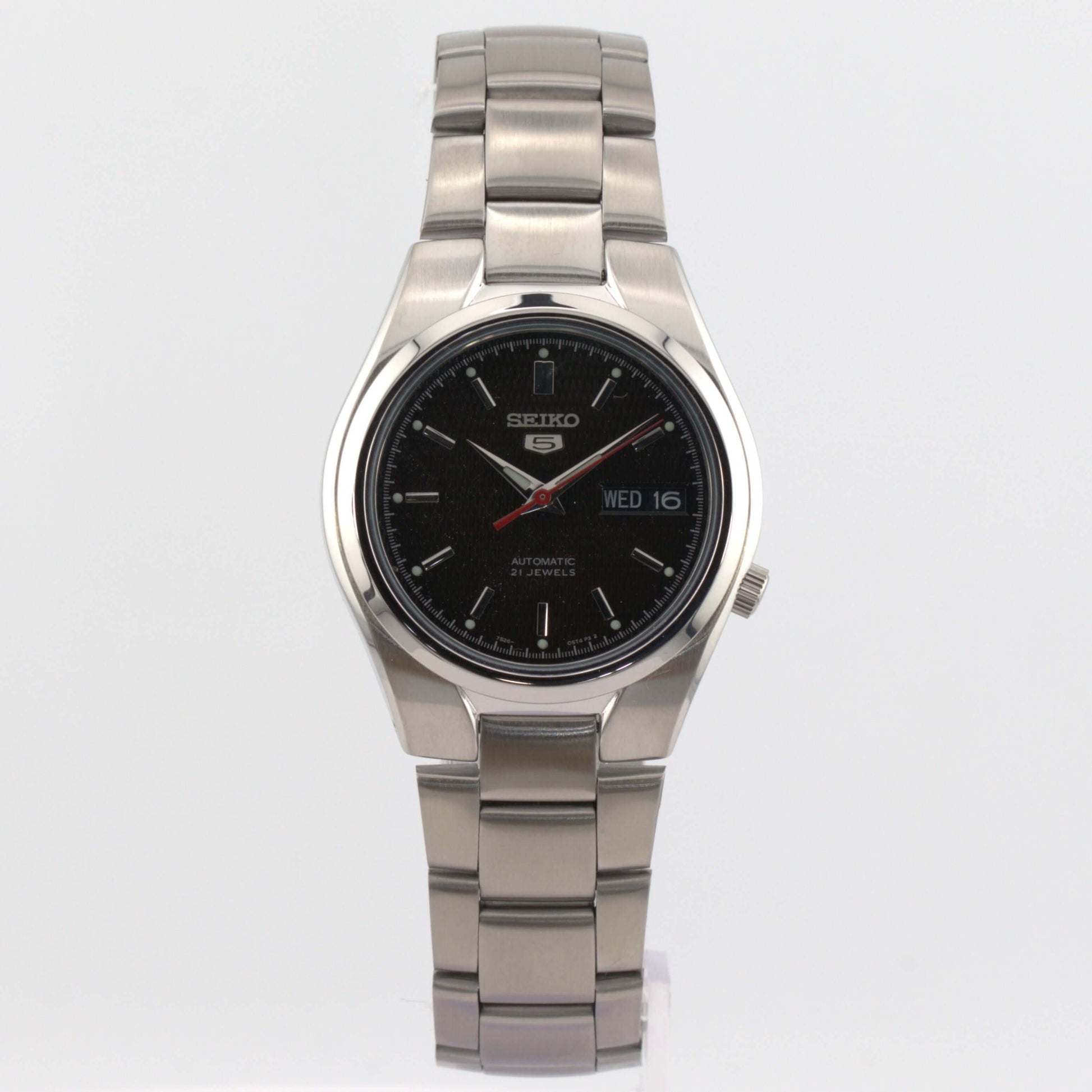 Seiko 5 automatic watch SNK607K1 featuring a black dial with luminous hands and a polished stainless steel case.