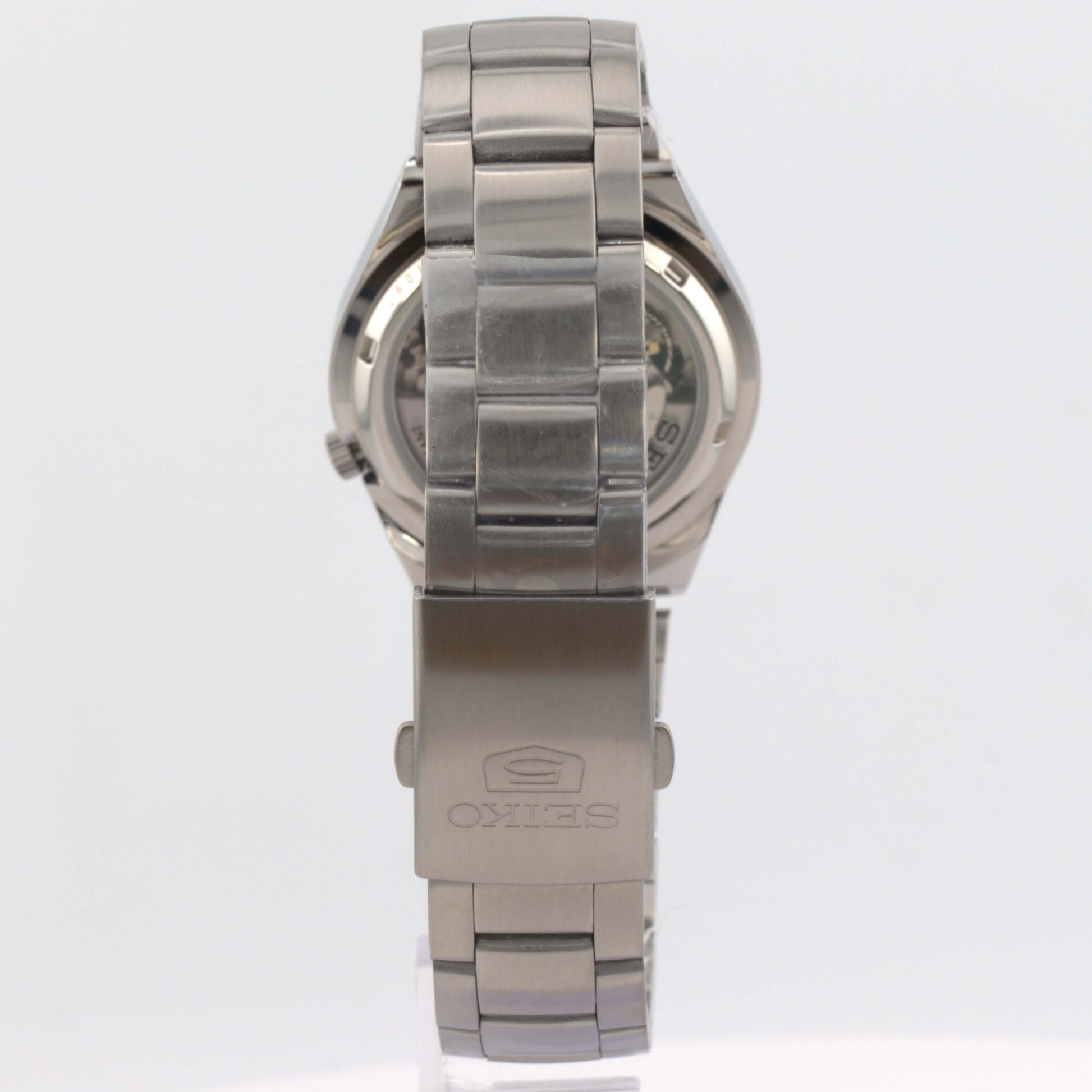 Seiko 5 automatic watch SNK607K1 stainless steel bracelet back view showcasing polished finish and logo.
