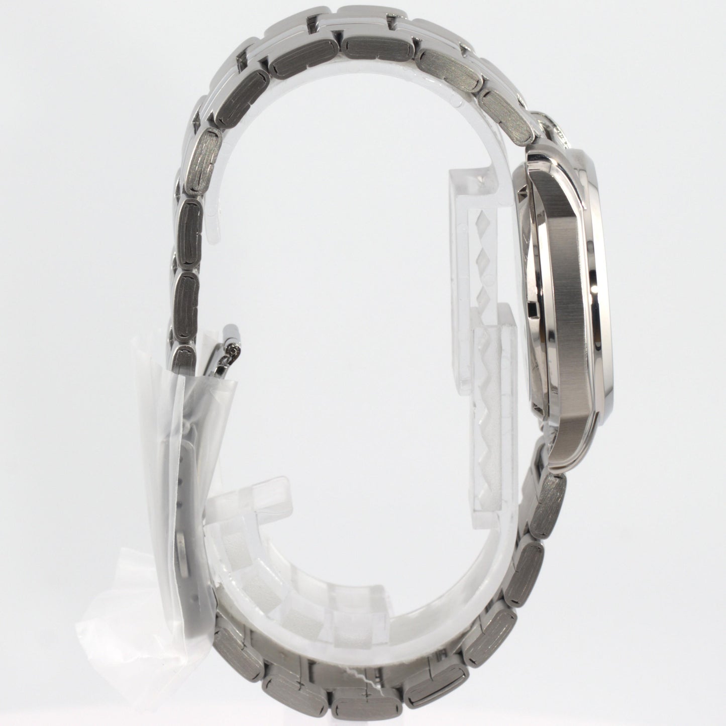 Seiko 5 automatic watch white dial side view showcasing its elegant design and stainless steel bracelet.