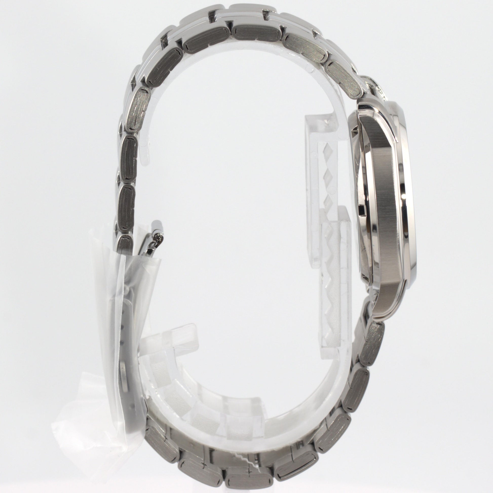 Seiko 5 automatic watch white dial side view showcasing its elegant design and stainless steel bracelet.