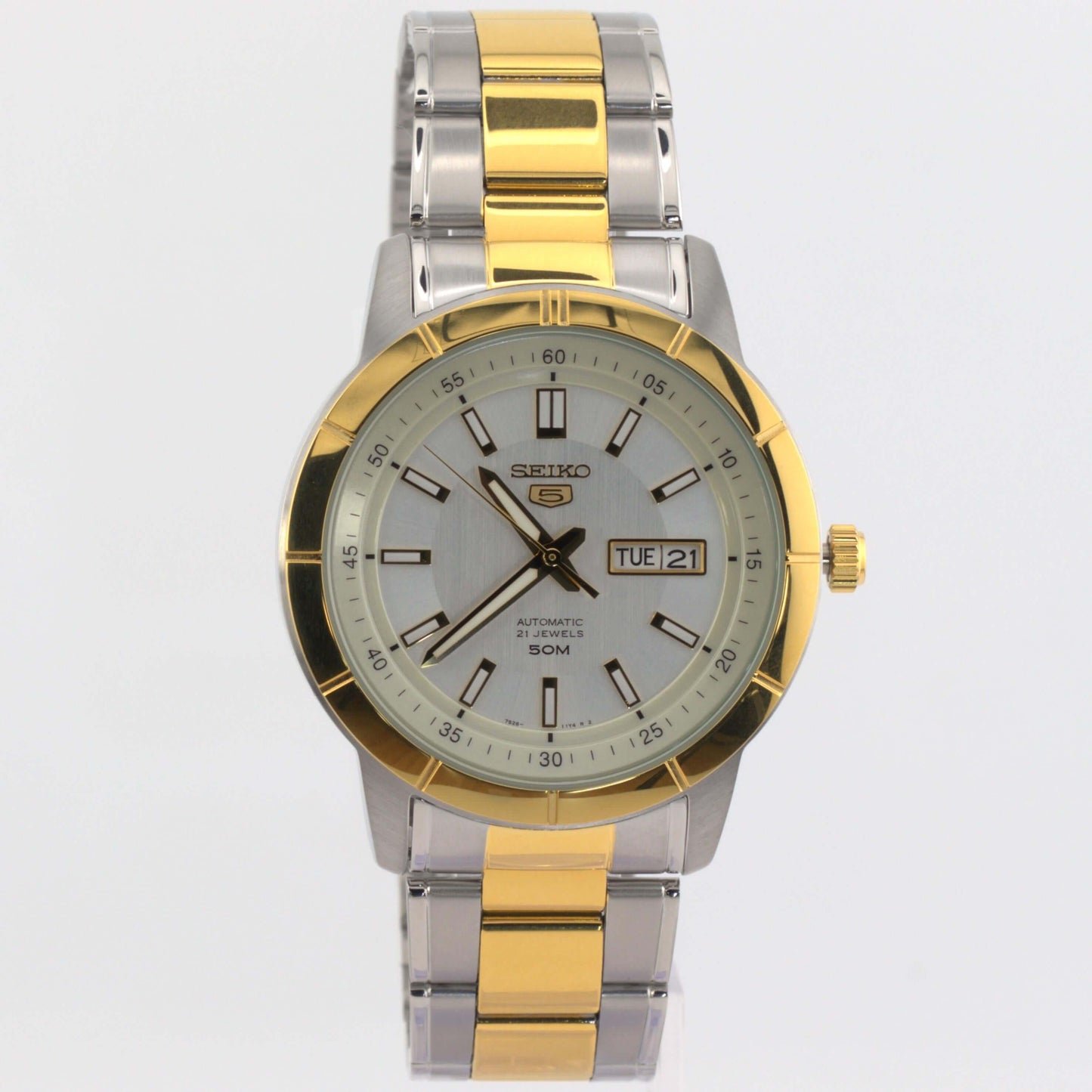 Seiko 5 silver watch SNKN58K1 with automatic movement and elegant two-tone design.