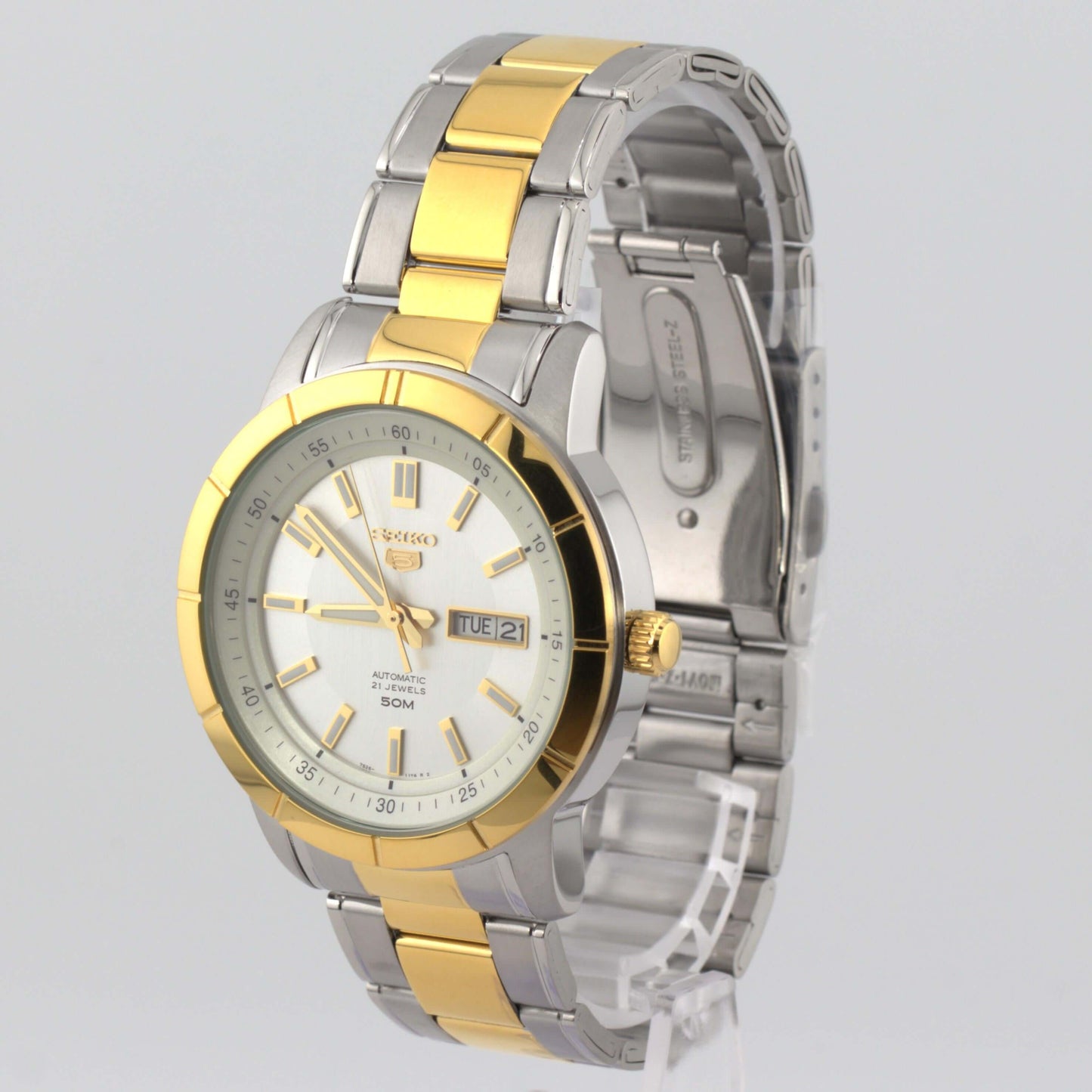 Seiko 5 silver watch SNKN58K1 featuring a silver and gold-tone design and automatic movement.