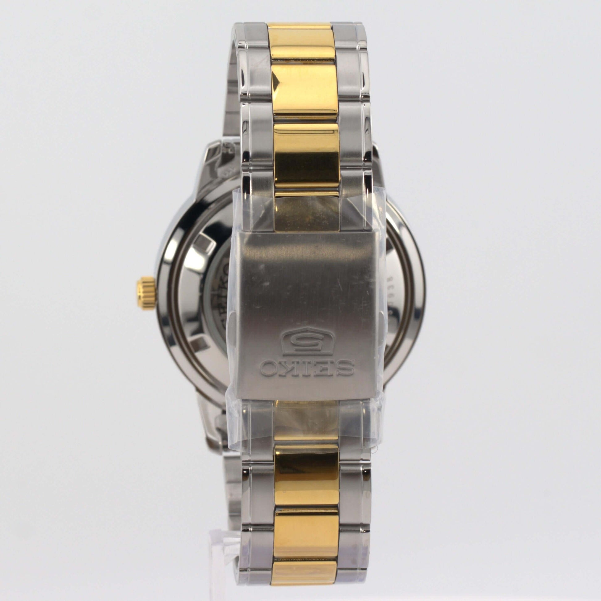 Seiko 5 silver watch SNKN58K1 showcasing its elegant two-tone stainless steel bracelet and robust stainless steel case.