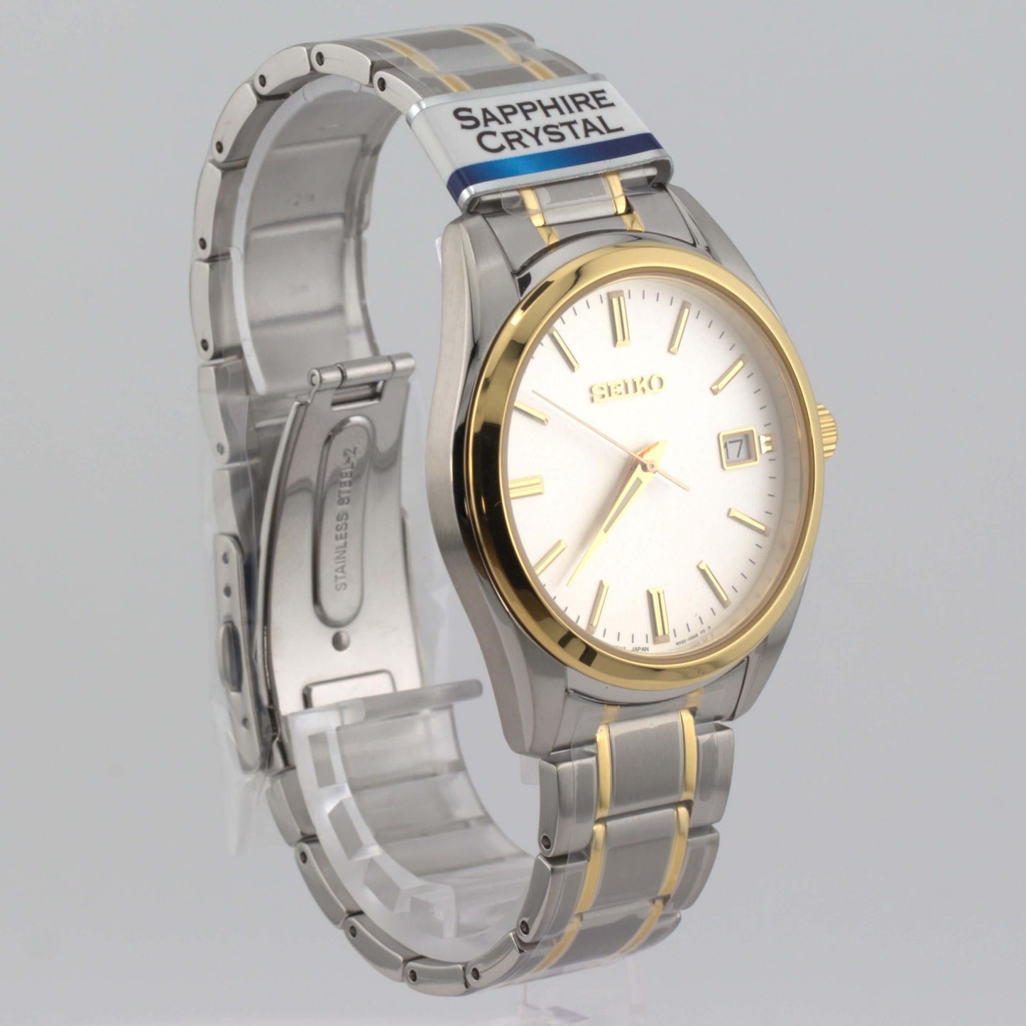 Seiko White Dial SUR312P1 men's quartz watch with two-tone stainless steel band and sapphire crystal.