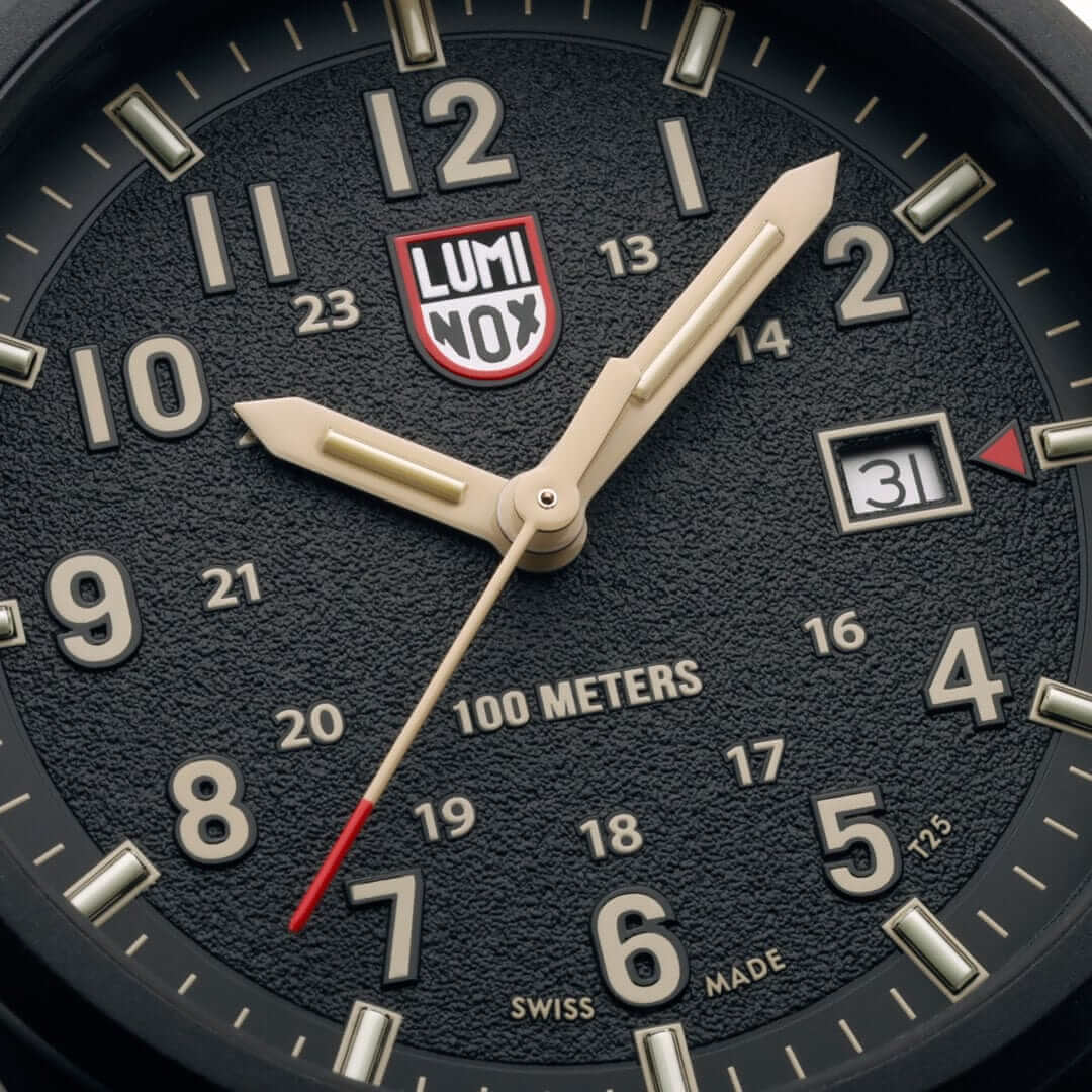 Luminox Atacama Field watch black dial with sand hour numbers and red second hand detail.