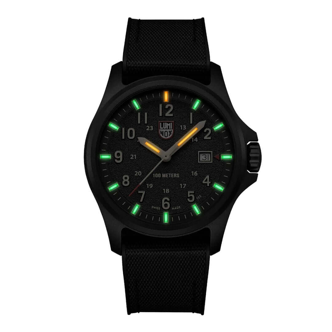 Luminox Atacama Field watch with black dial, green and orange markers, and textured strap, 43mm size.