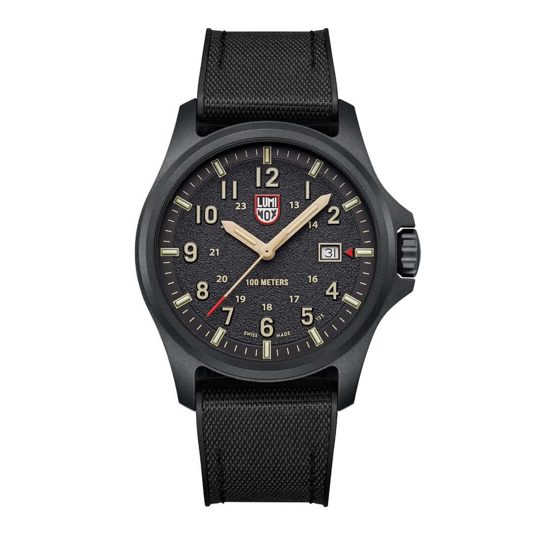 Luminox Atacama Field watch with a black dial and textured finish, featuring sand hour numbers and red accents.