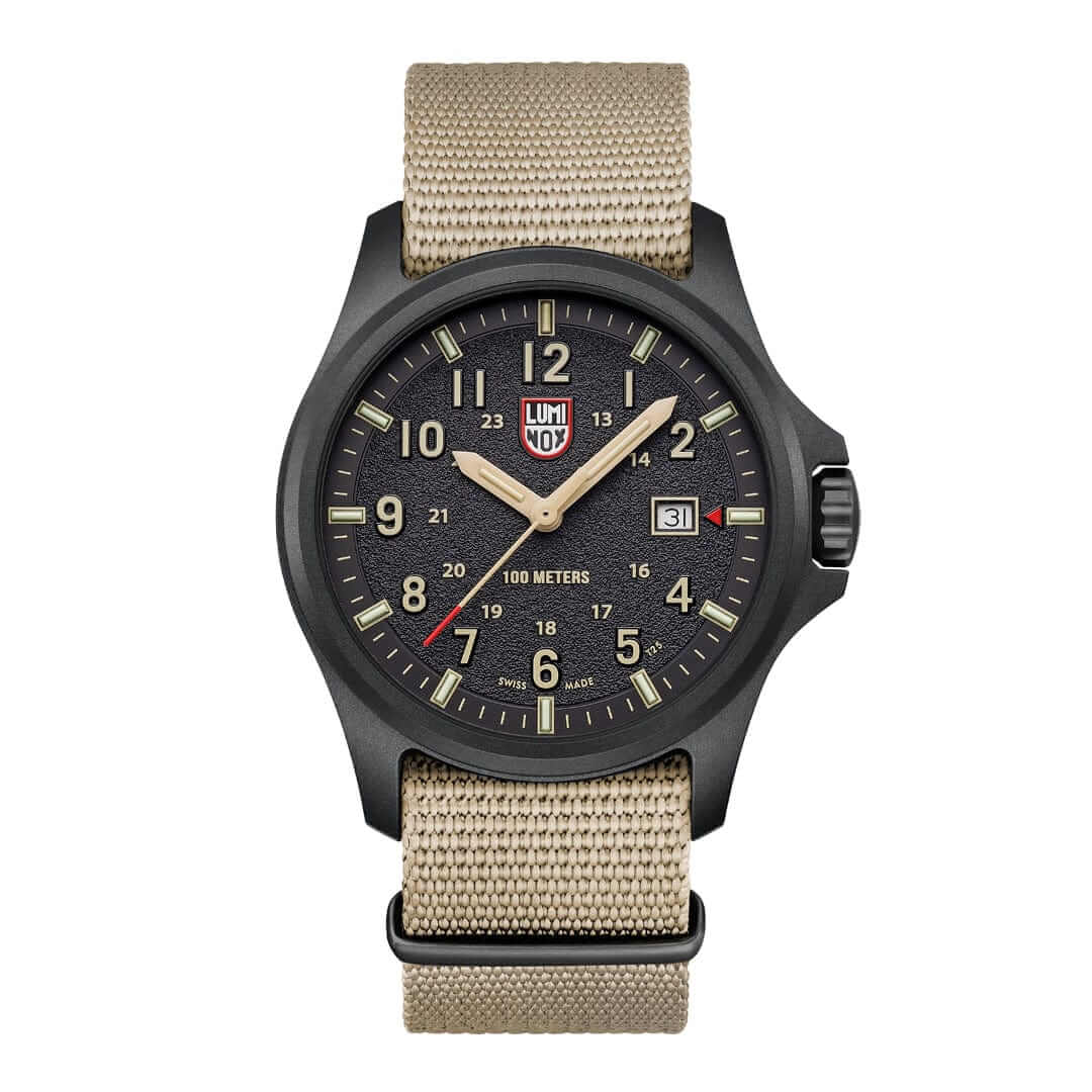 Luminox Atacama Field watch featuring black dial, textured finish, sand hour numbers, and stylish khaki strap.