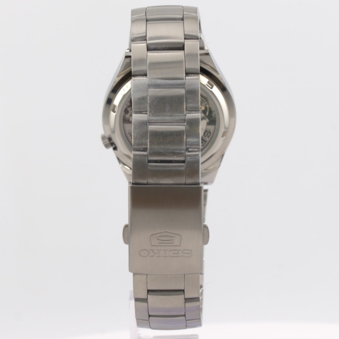 Side view of the Seiko 5 automatic men's watch showing the stainless steel bracelet and clasp.