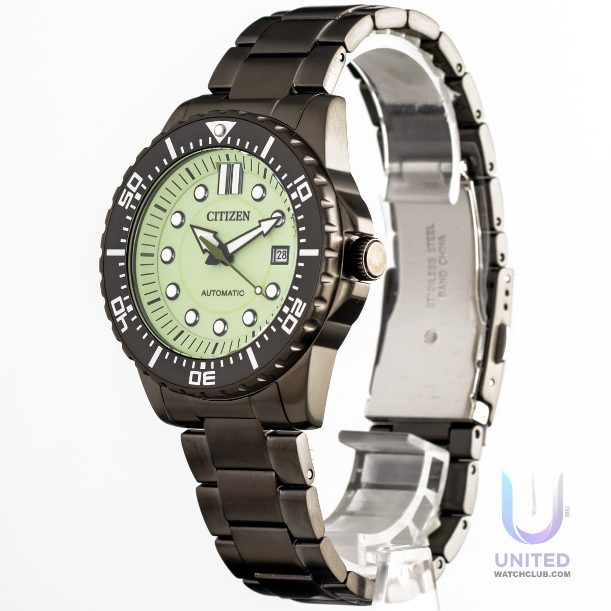 Citizen mechanical watch green dial in black stainless steel case and bracelet, showcasing its luminous display.