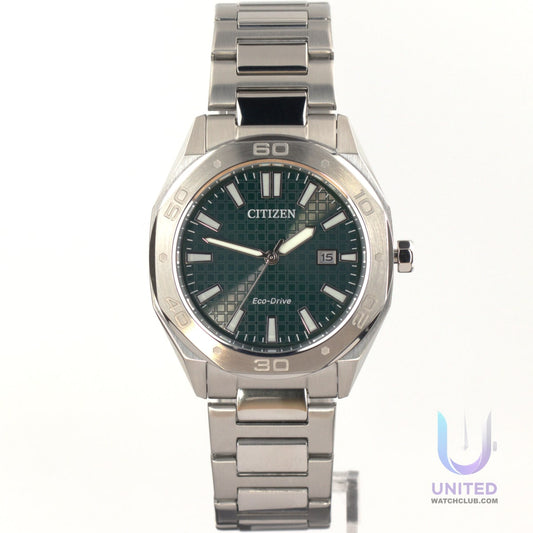 Citizen Eco-Drive green dial watch with stainless steel bracelet and date function.