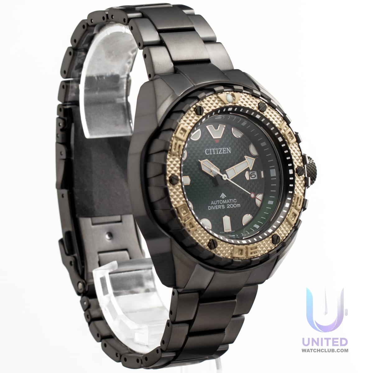 Citizen Promaster Marine green dial watch on display with black strap and gold bezel, showcasing its robust and stylish design.