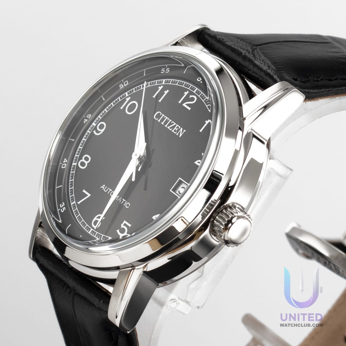 Citizen automatic black dial dress watch with stainless steel case and leather strap, 40mm diameter.