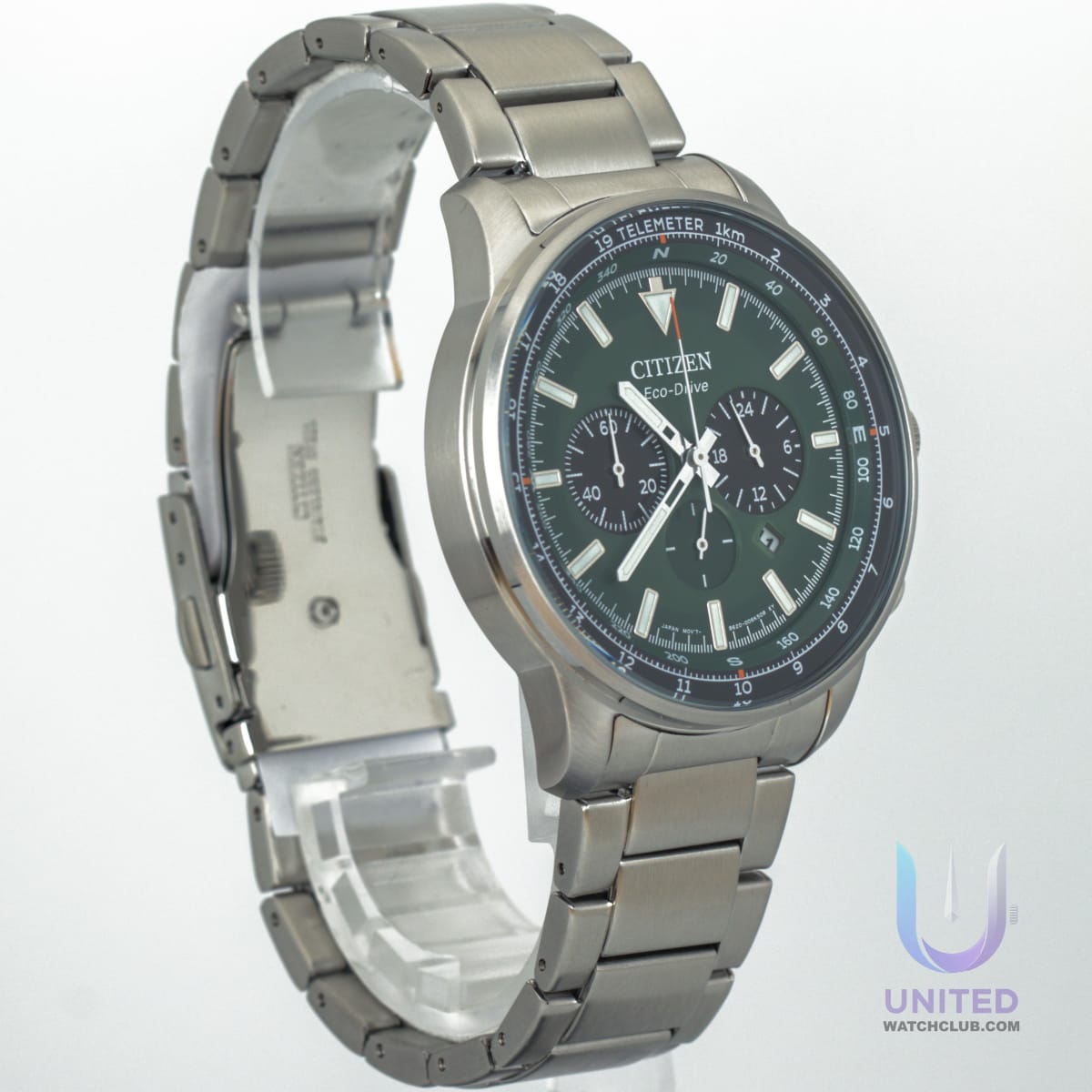 Citizen Eco-Drive chronograph watch with green dial and stainless steel bracelet.