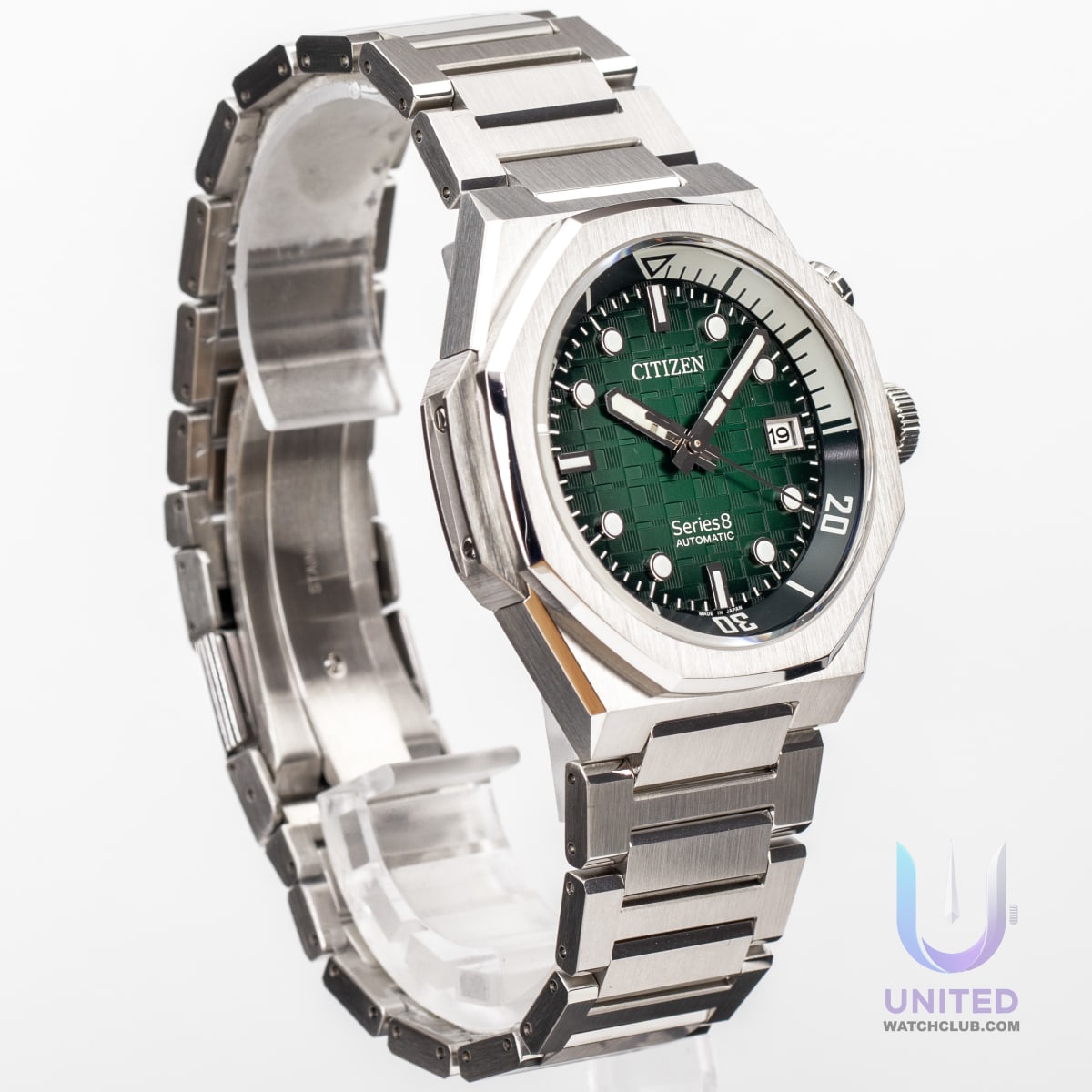 Citizen Series8 green dial watch with silver-tone stainless steel case and textured green dial, displaying date feature.