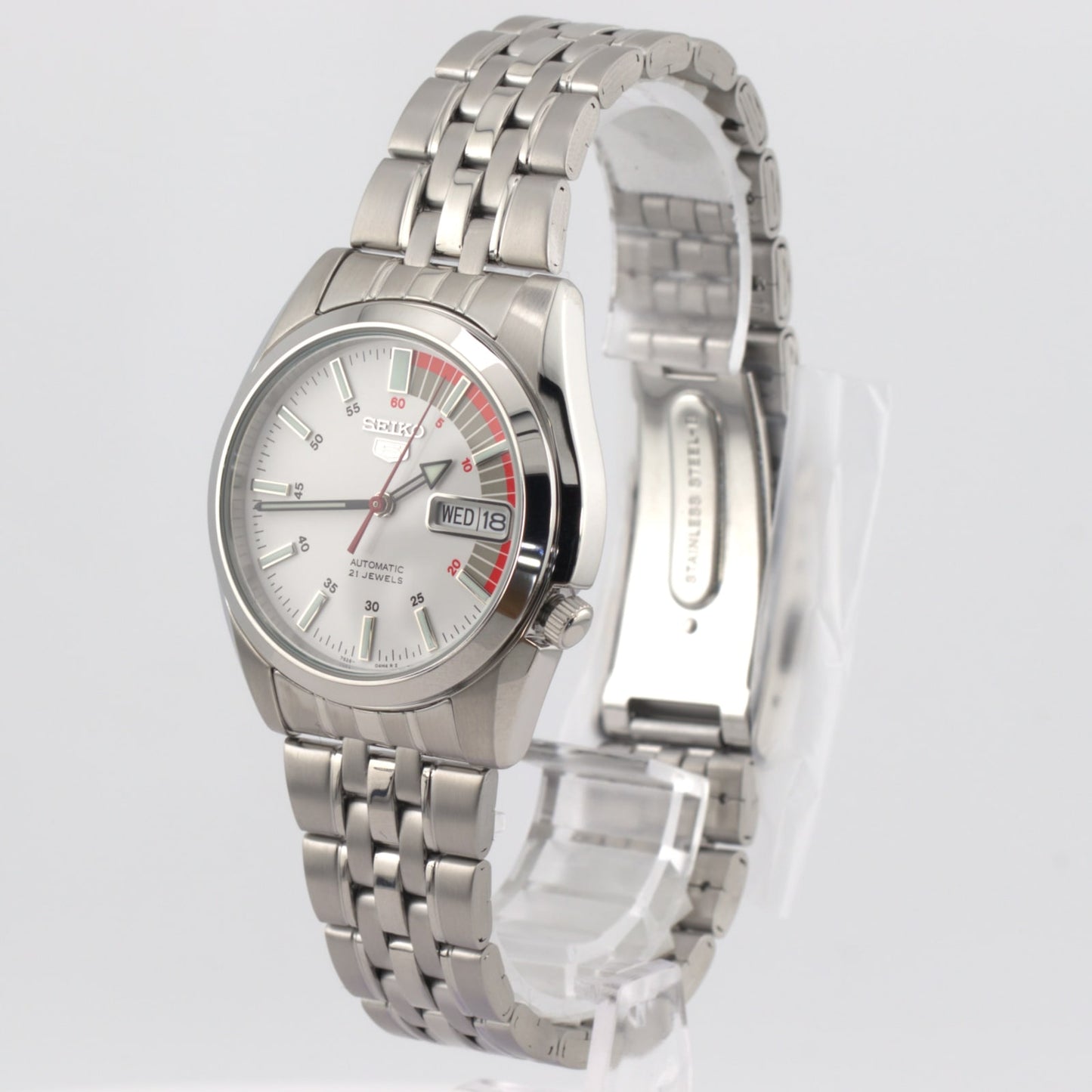 Seiko 5 automatic white dial watch showcasing classic design with a stainless steel bracelet and easy-to-read face.
