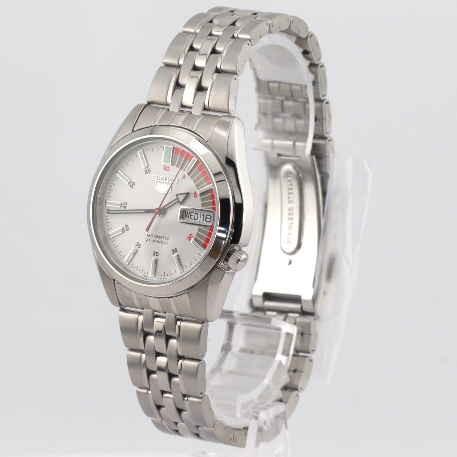 Seiko 5 automatic white dial watch showcasing classic design with a stainless steel bracelet and easy-to-read face.