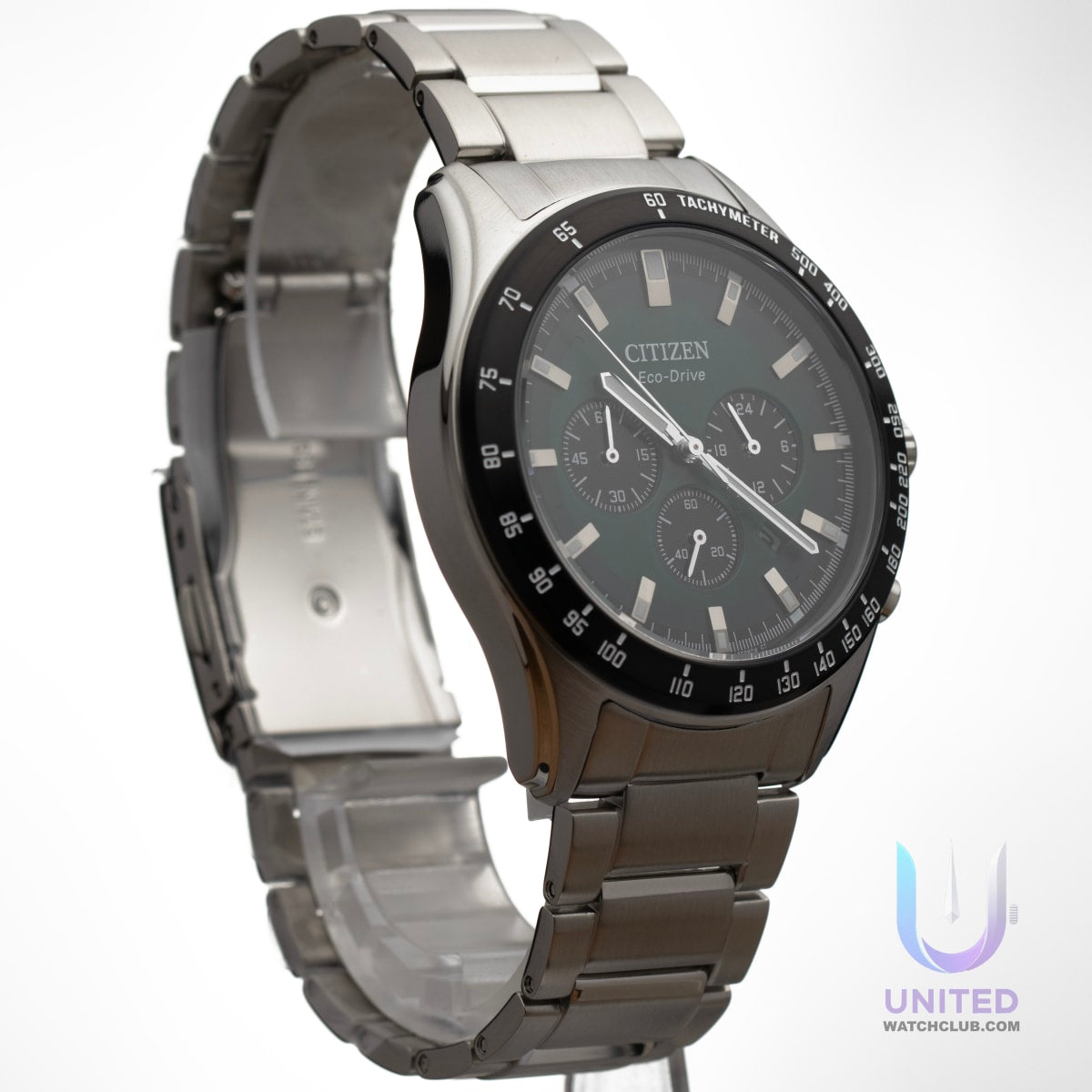 Citizen Eco-Drive green dial chronograph watch on display with stainless steel bracelet and stylish black dial.
