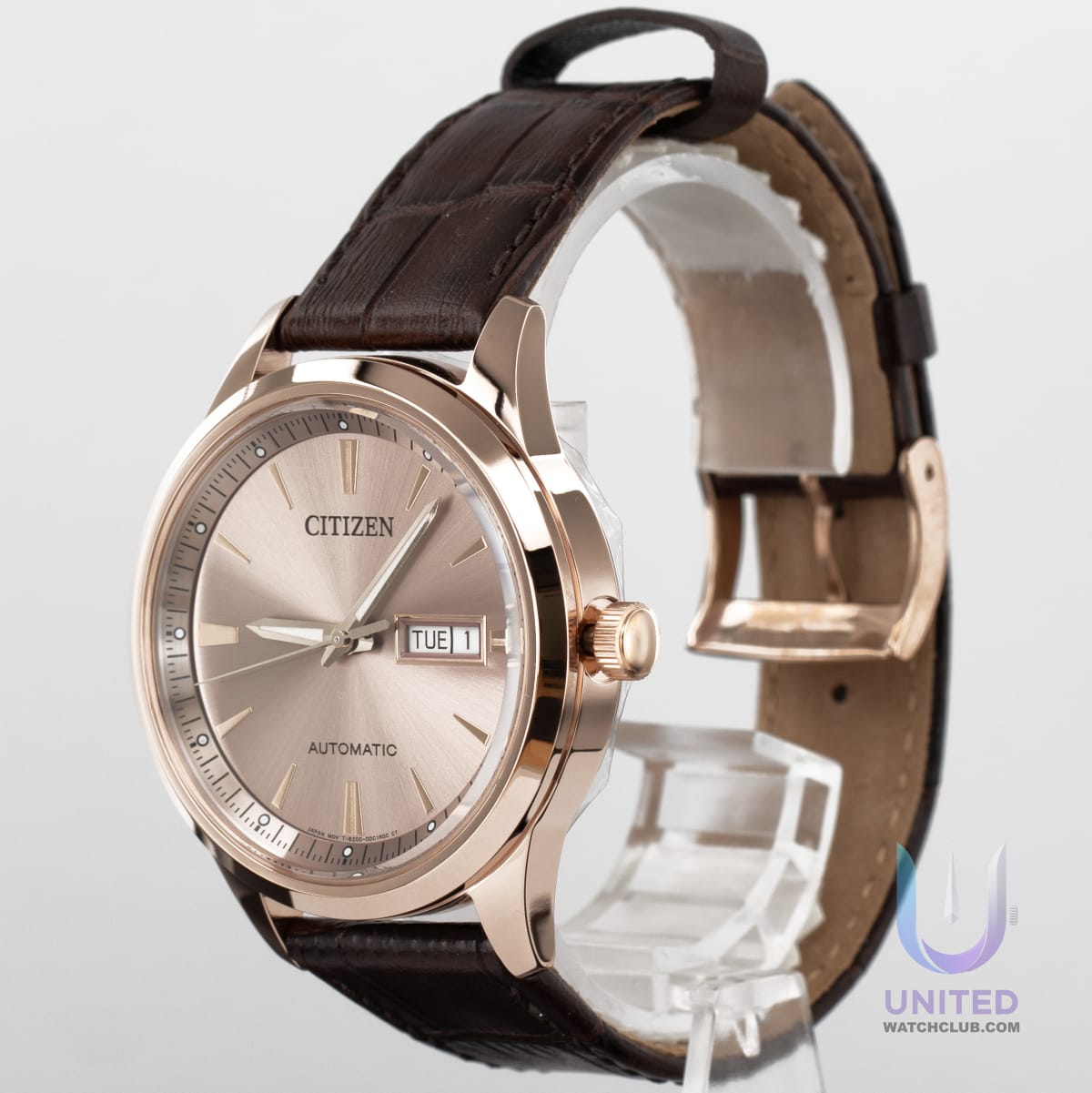 Citizen automatic watch beige dial on a brown leather strap, showcasing precision timekeeping and elegant design.